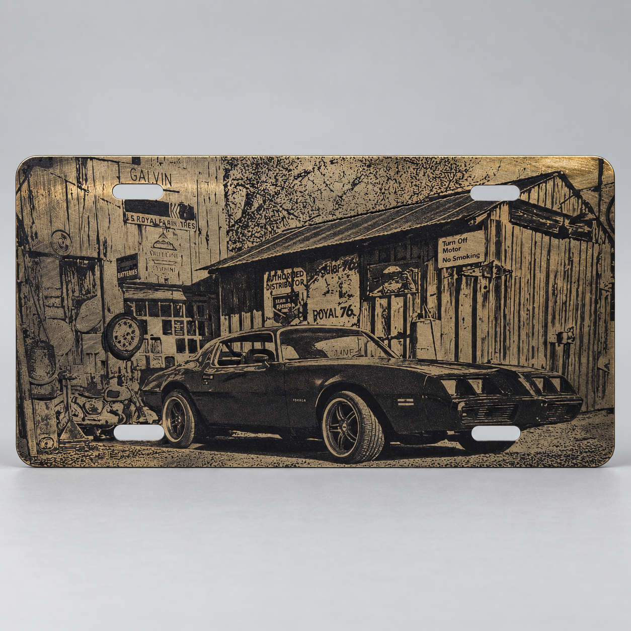 Metal plate engraved with a vintage car in front of an old service station